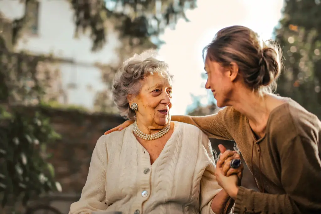 Woman caring for an elderly woman